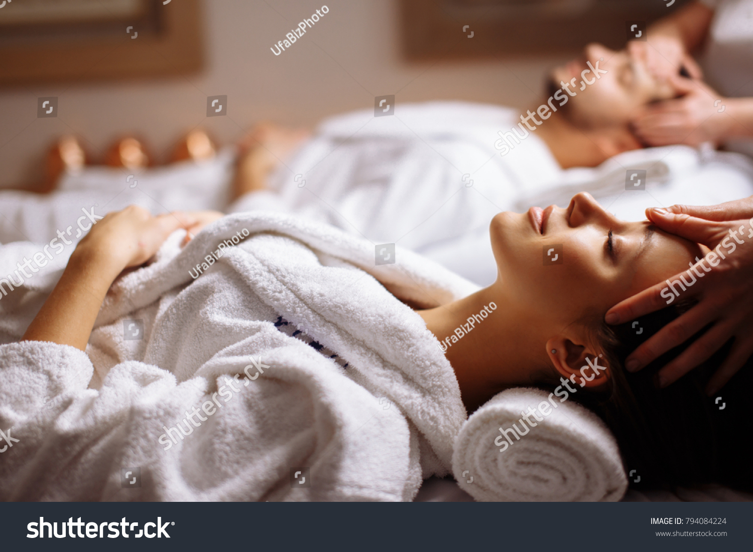 stock-photo-young-couple-receiving-head-massage-at-beauty-spa-794084224