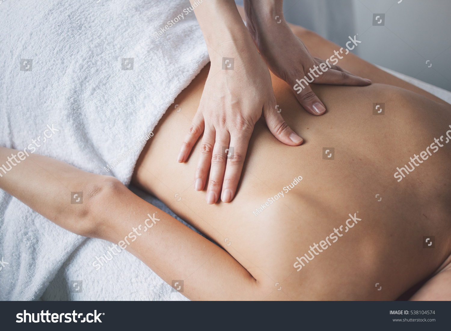 stock-photo-young-woman-relaxing-with-hand-massage-at-beauty-spa-538104574